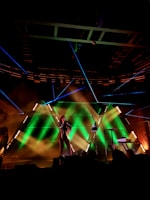 man on stage performing at nighttime