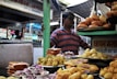 A vibrant market stall filled with fresh snacks and sweets from Andhra Pradesh.