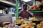 A vibrant market stall filled with fresh snacks and sweets from Andhra Pradesh.