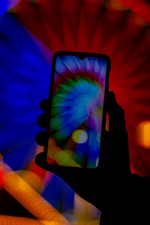 Minimalist smartphone silhouette against a backdrop of swirling blue light trails