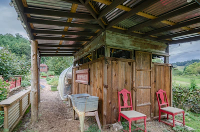 A friendly consultant discussing tensile shed options with a customer outdoors.