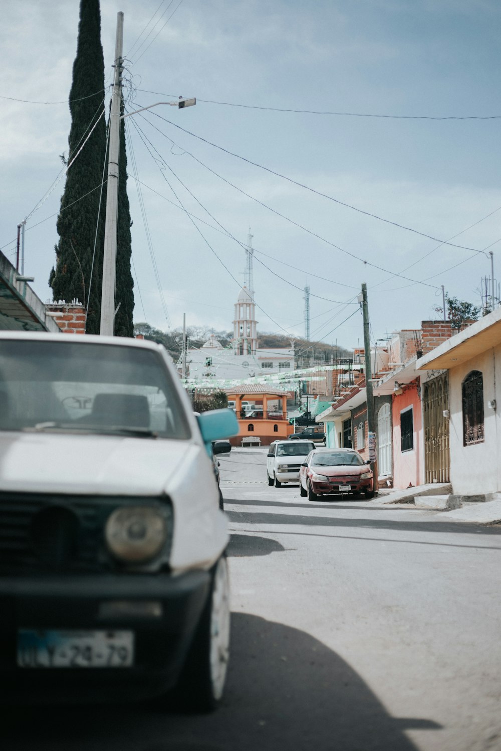 white vehicle on road during daytime