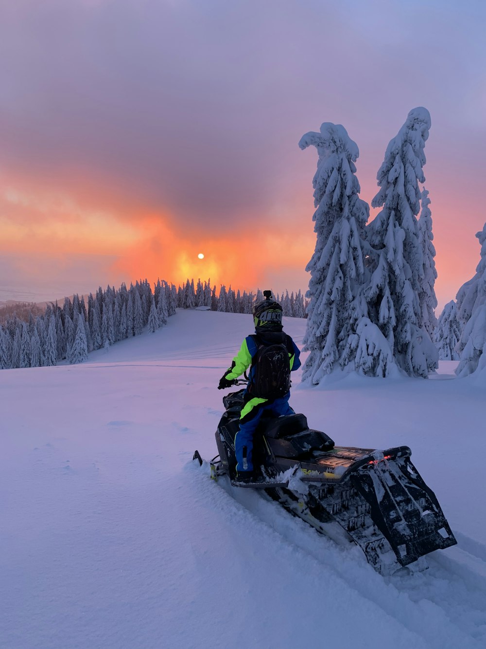 person riding snowmobile