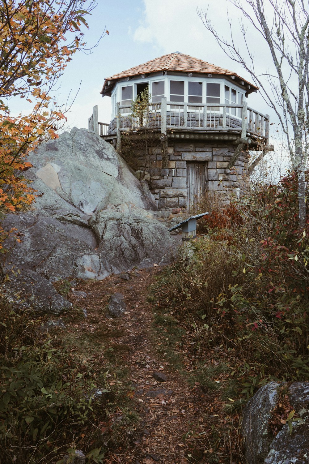 concrete building beside of rock