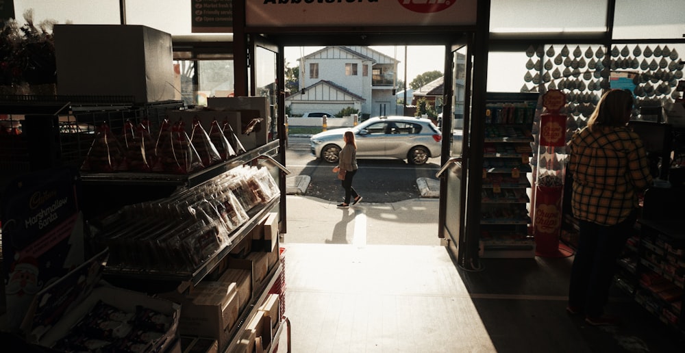 woman walking near store