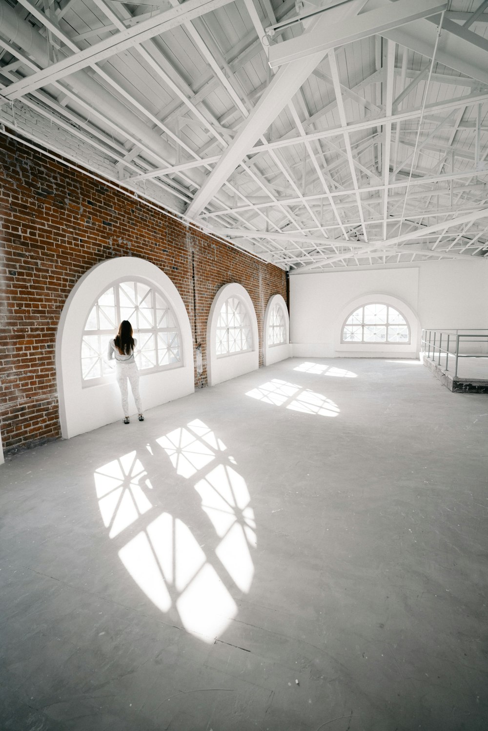 woman standing in front of window