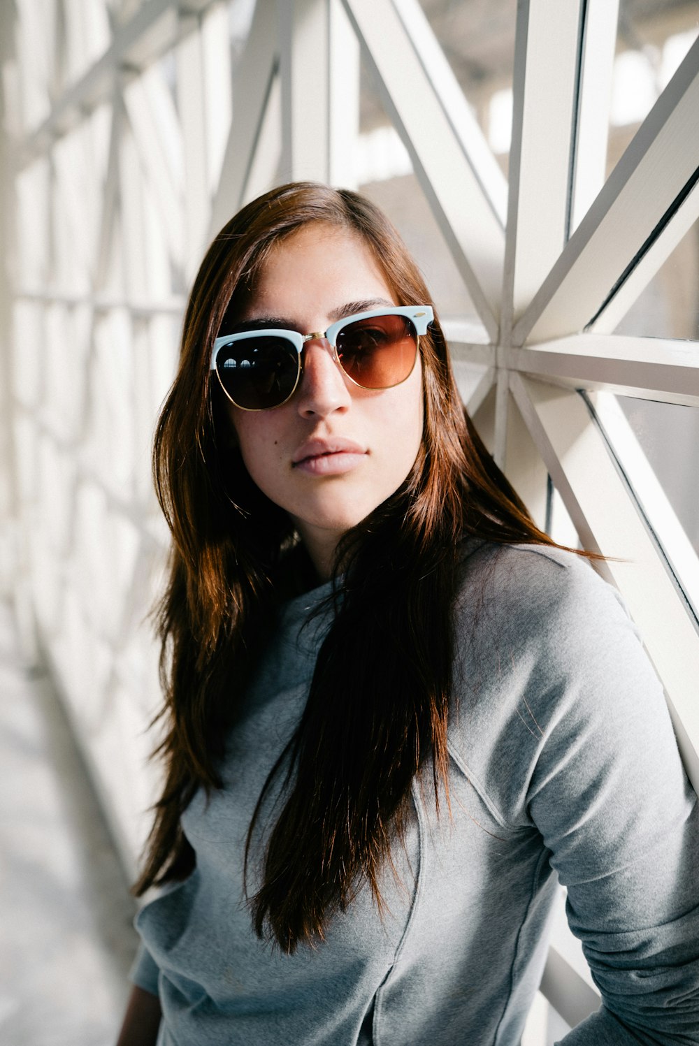 woman wearing grey frame sunglasses