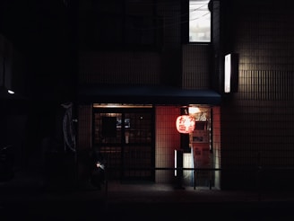 red and white pendant lamp on building