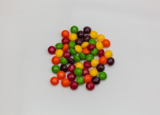 assorted-color chocolates on white surface