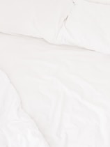 Close-up of comfortable hotel bed with soft linens