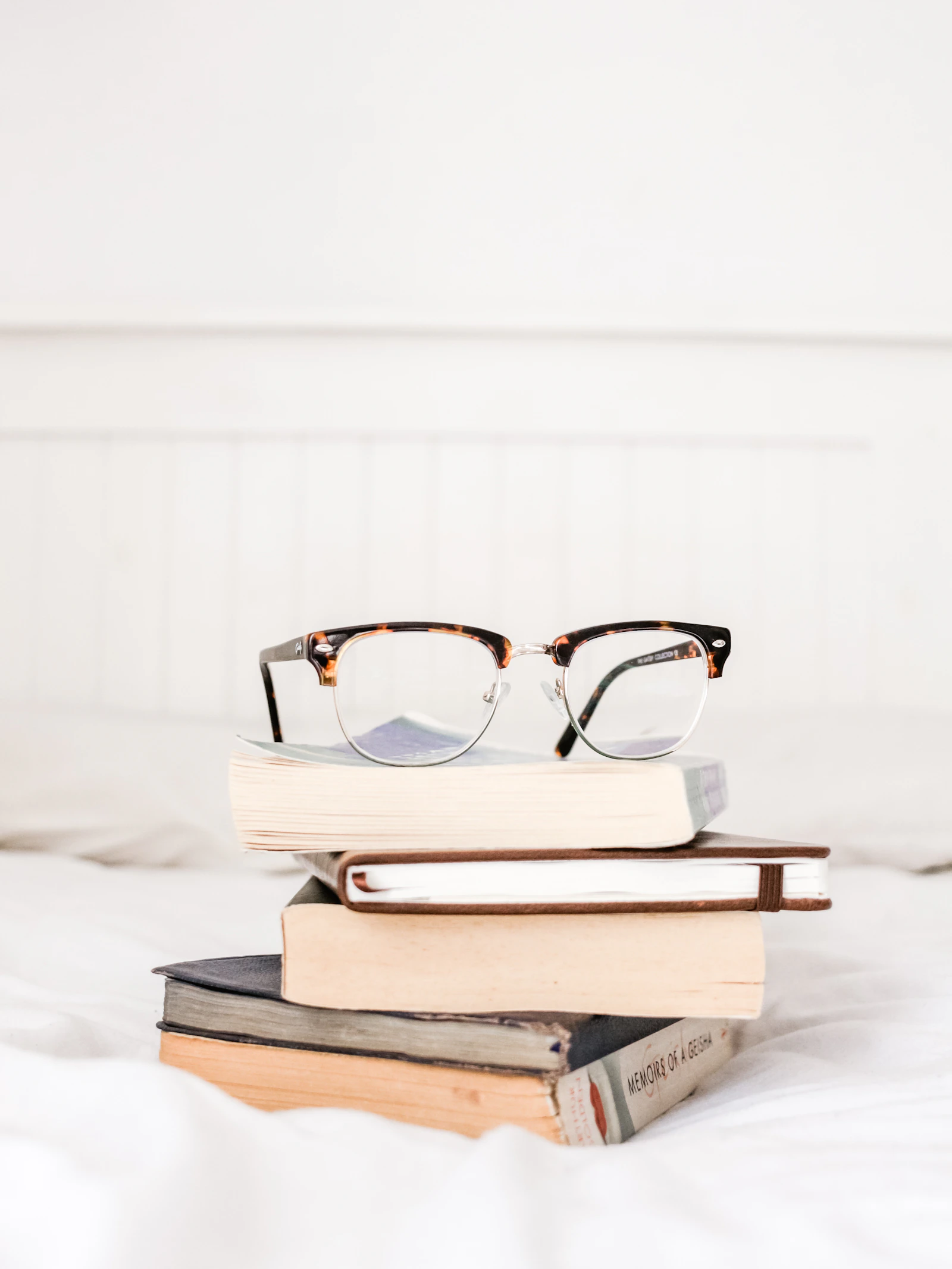 Premium eyeglasses displayed with a clean optical lifestyle mood
