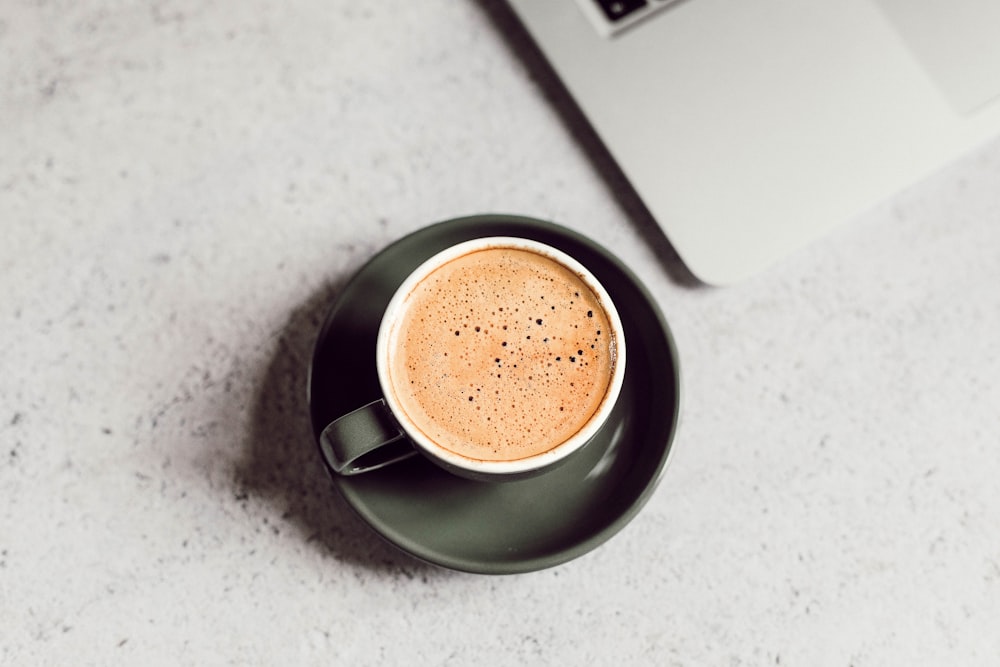 cappuccino in teacup on saucer