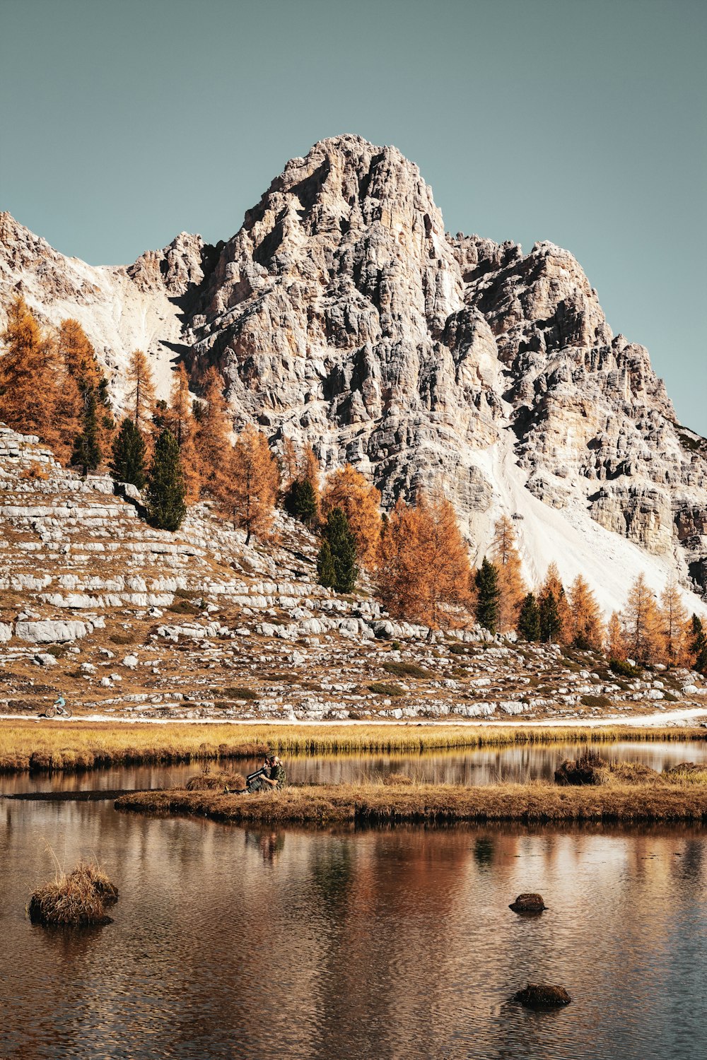 brown mountains across body of water