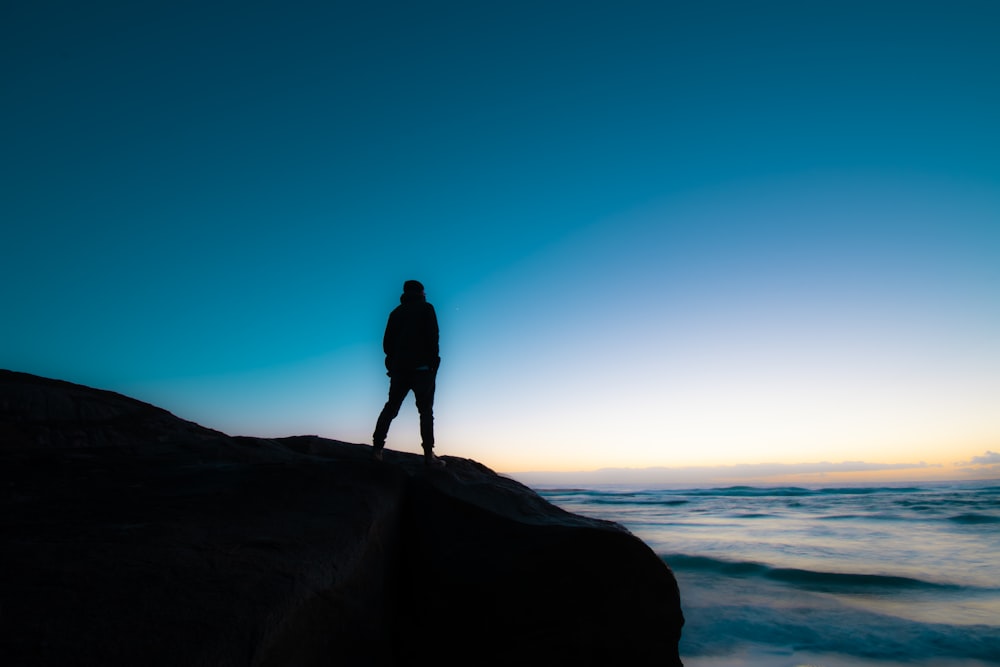 person standing on cliff