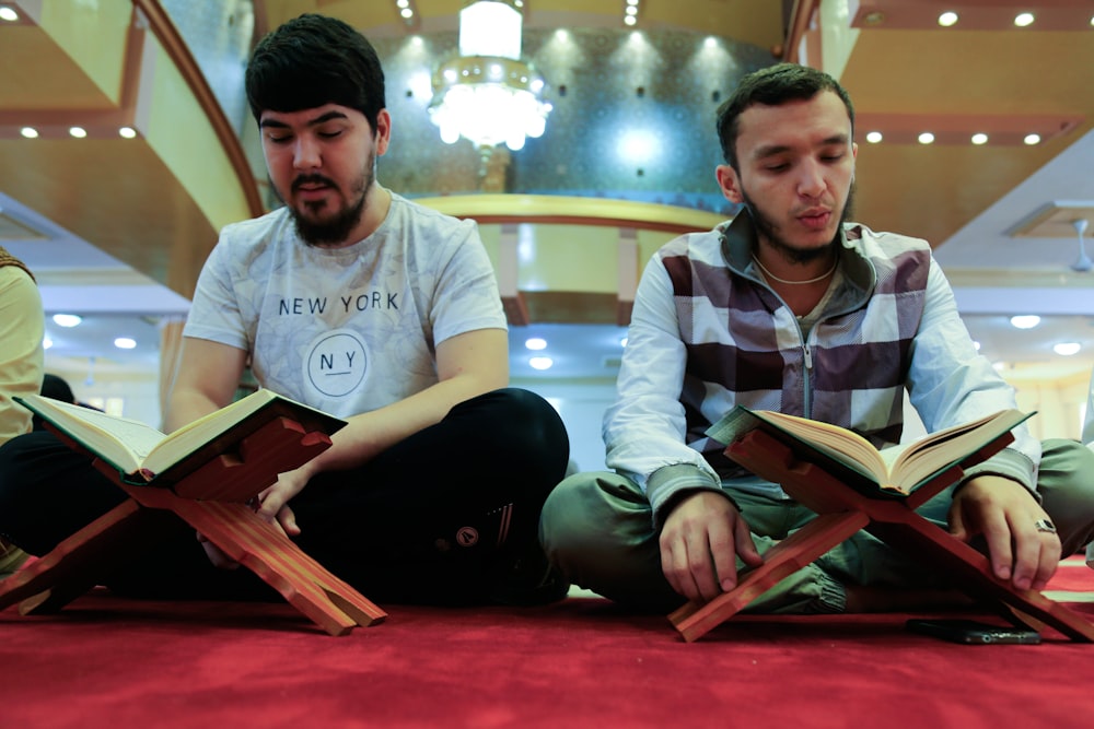 two men reading books