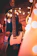 A cozy evening setting with a softly lit guitar and microphone ready for a private event.
