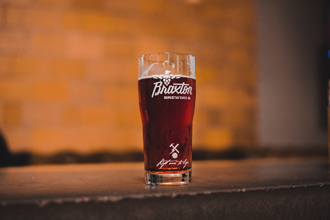 filled beer glass cup on table