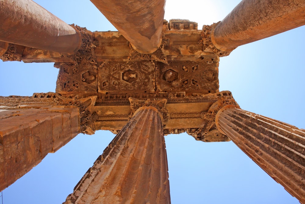 low angle photography of brown pillars