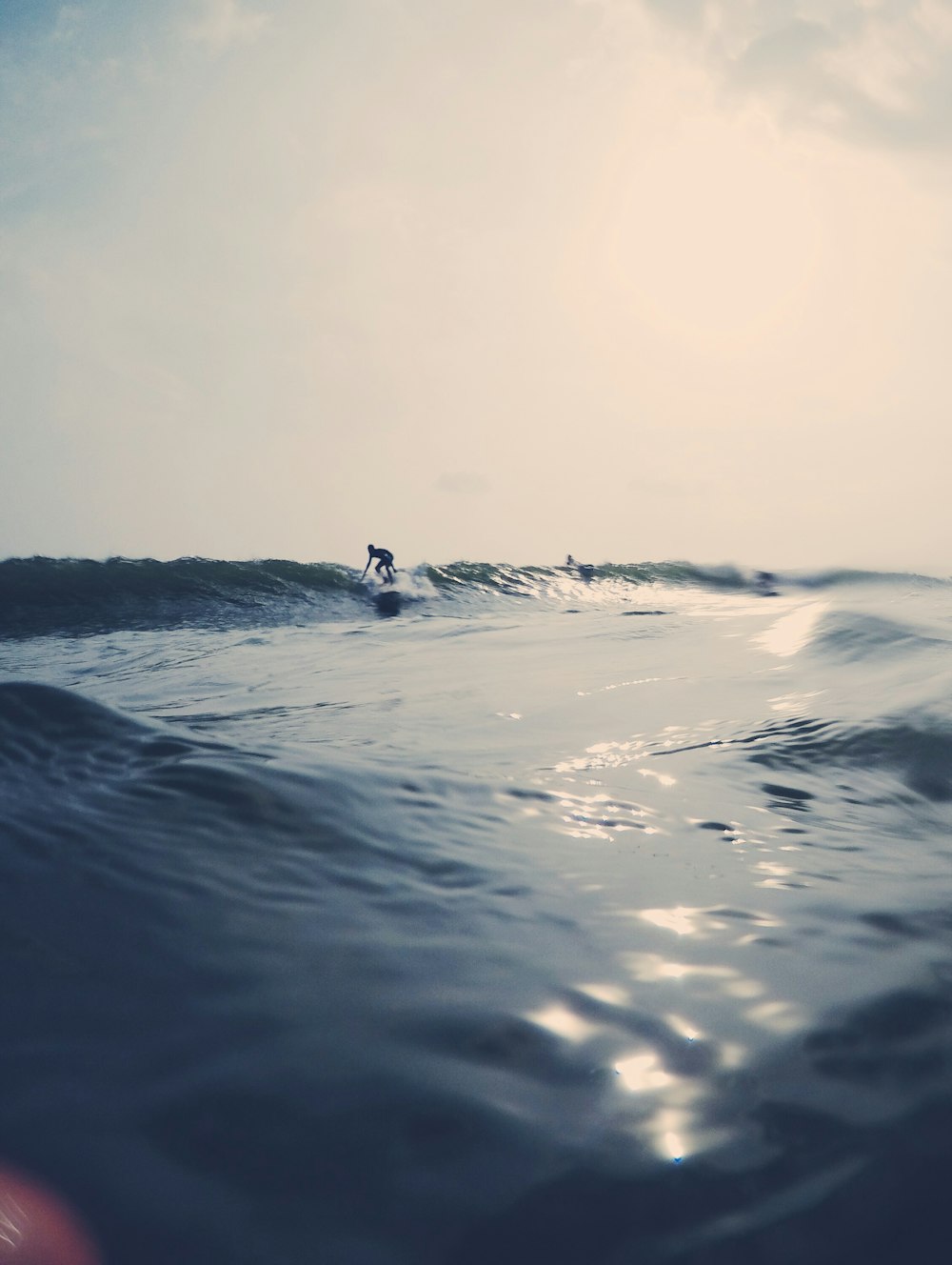 person surfing on sea during daytime