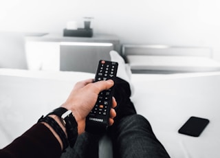 man using black remote control
