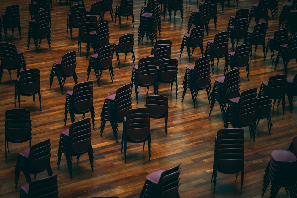 black stackable chair lot inside building