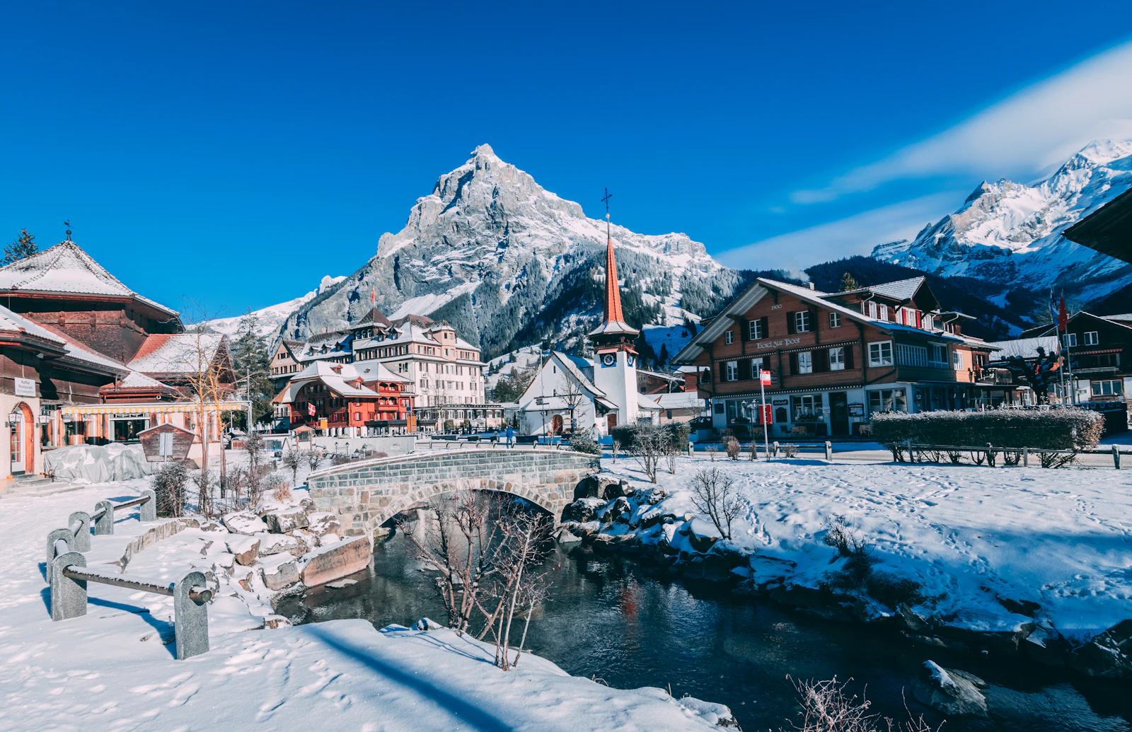 Mürren houses covered with snow beneath the mountains in winter