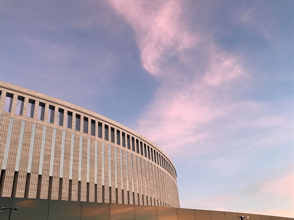 low-angle photography of gray concrete building during daytime