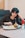 woman sitting in front of tray of food