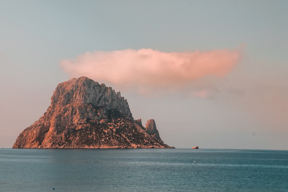 island under white clouds