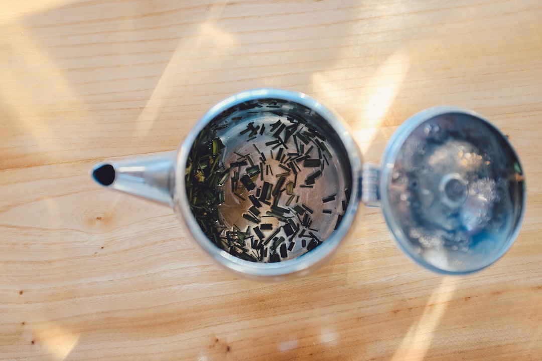 empty teapot on wooden surface