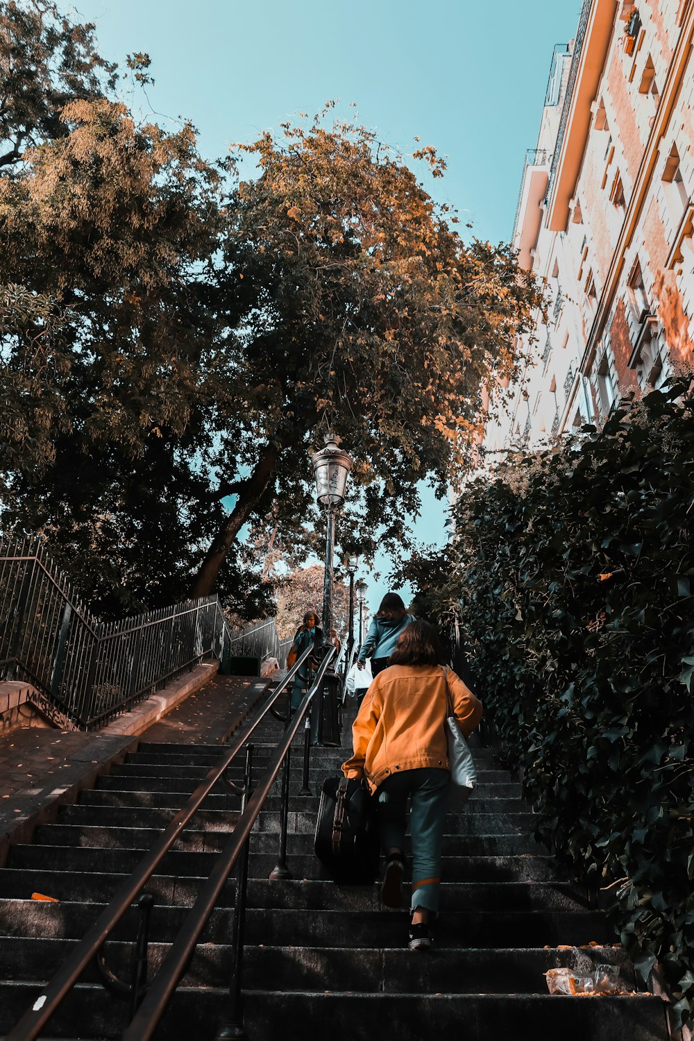 person walking on stair during daytime