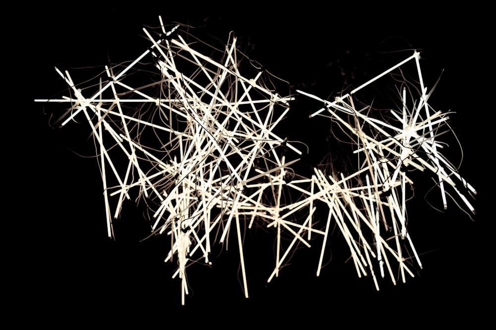 lighted sticks on black background