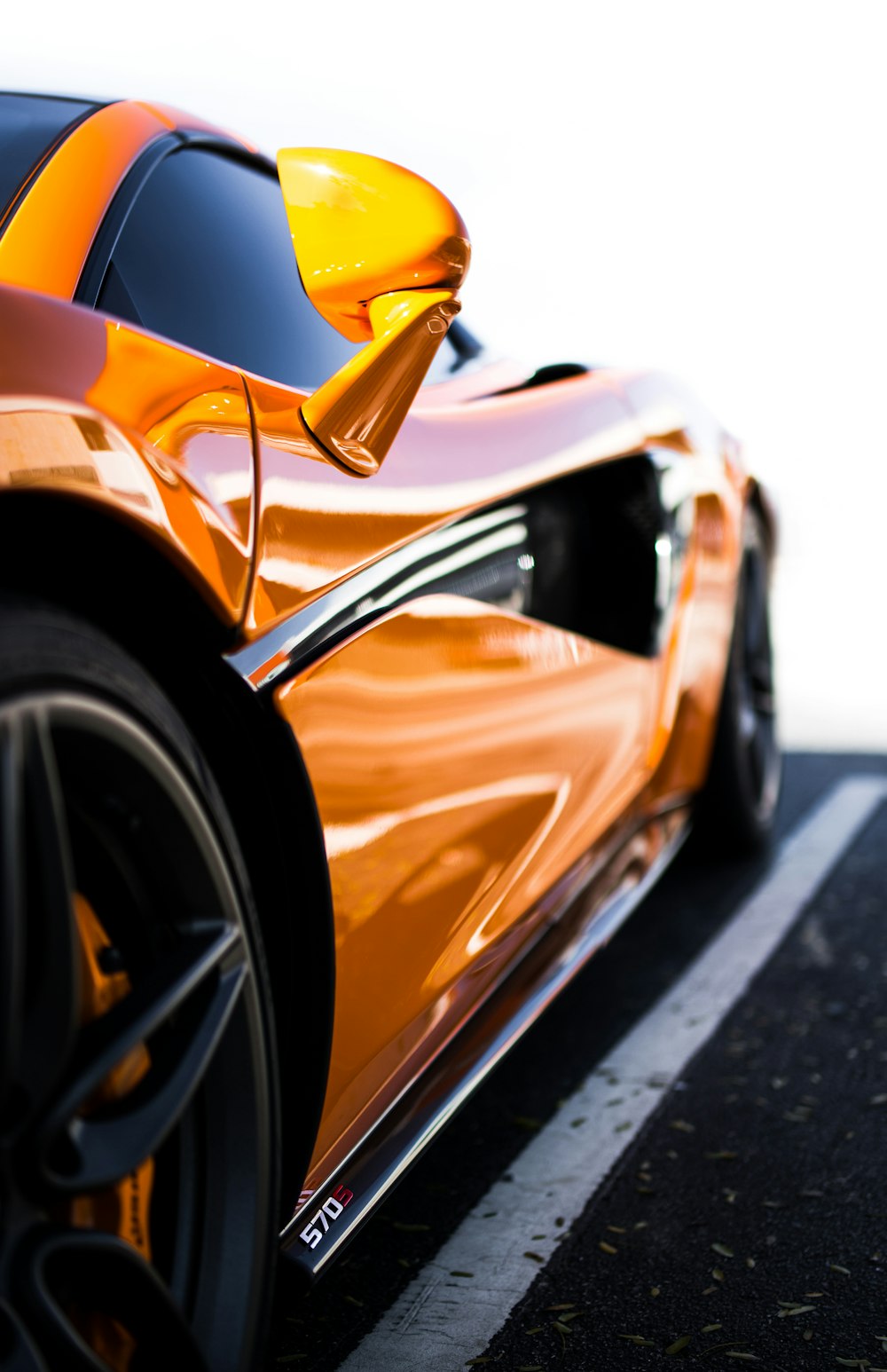 orange sports coupe during daytime