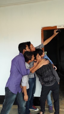 A nostalgic photo of classmates laughing together during their school days at Federal Government College Wukari.