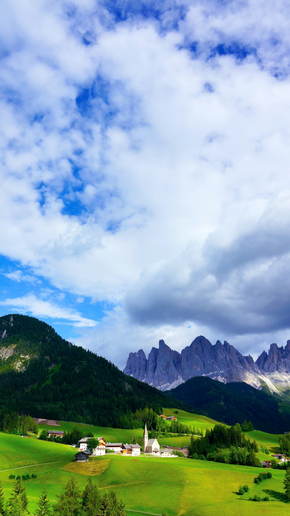 rock formation under white and blue sky