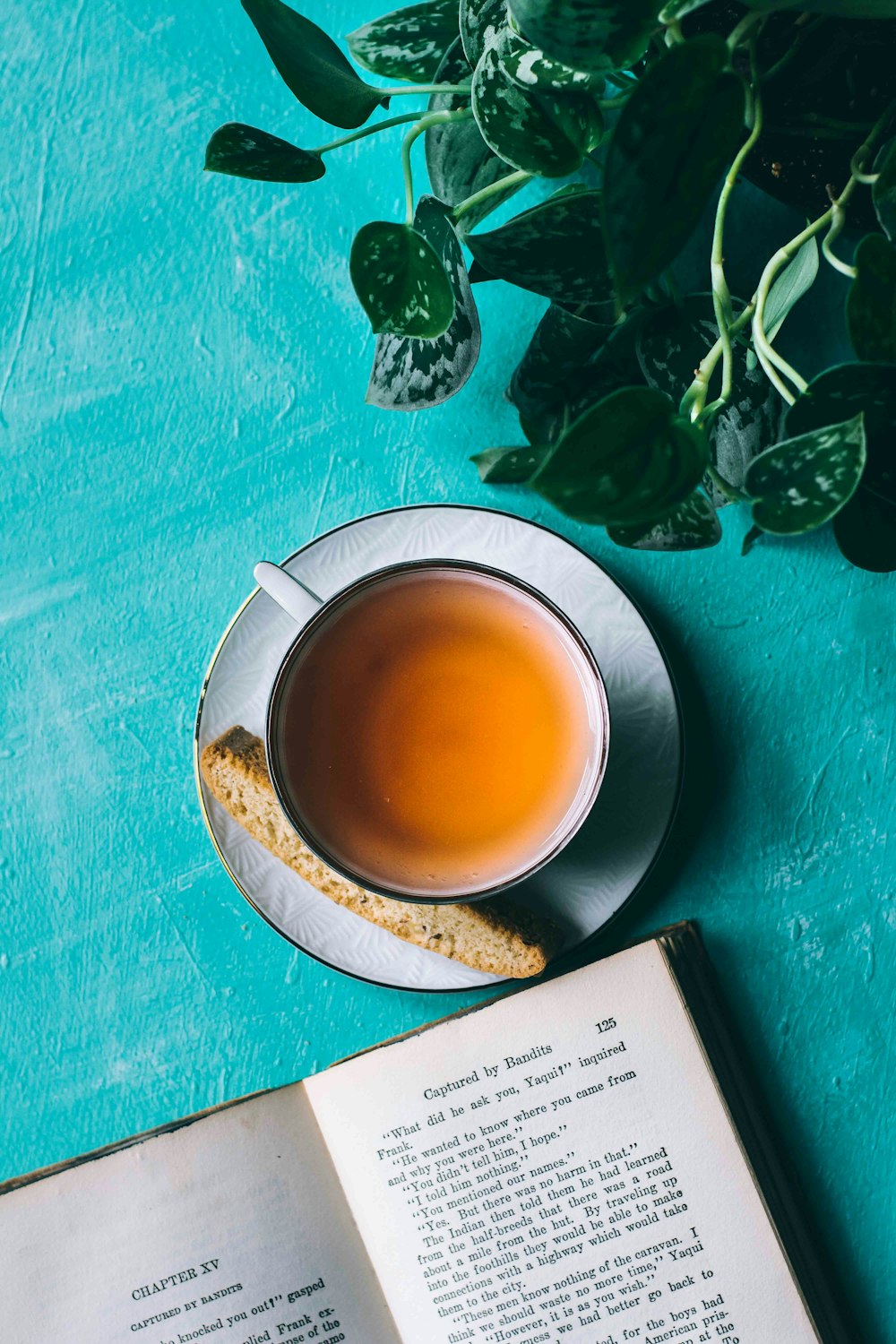 yellow liquid in white ceramic teacup