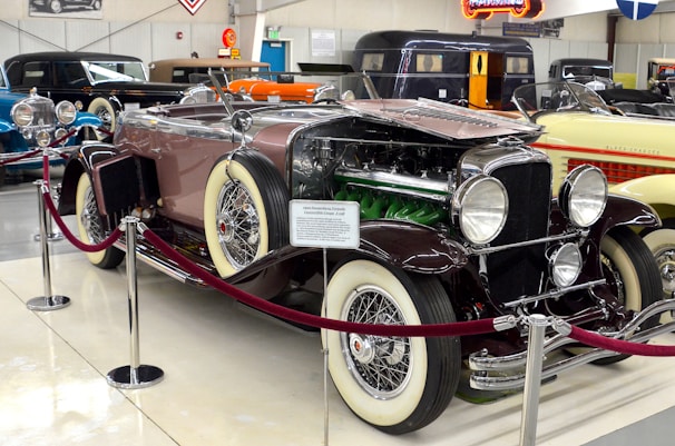 A vintage car displayed at an auto show.