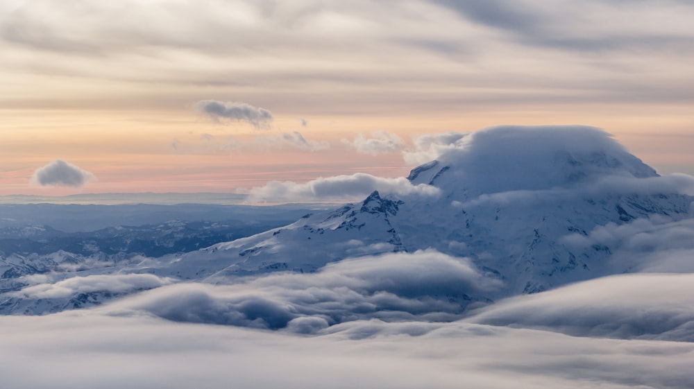 white mountain and clouds during daytime