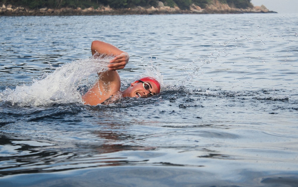 person swimming on beach