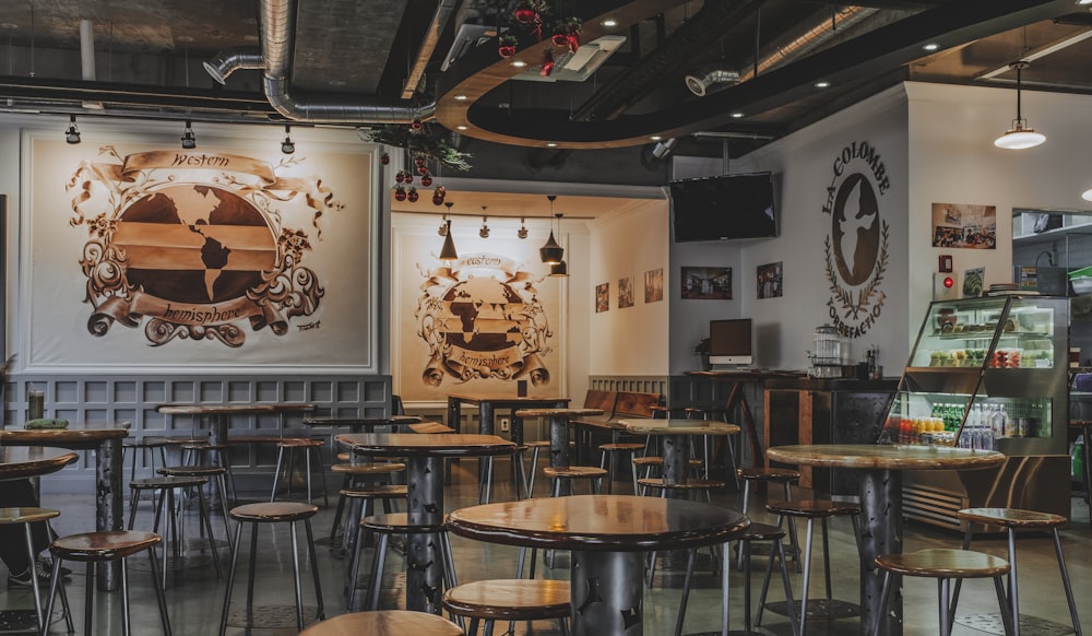 brown wooden tables with chairs inside building