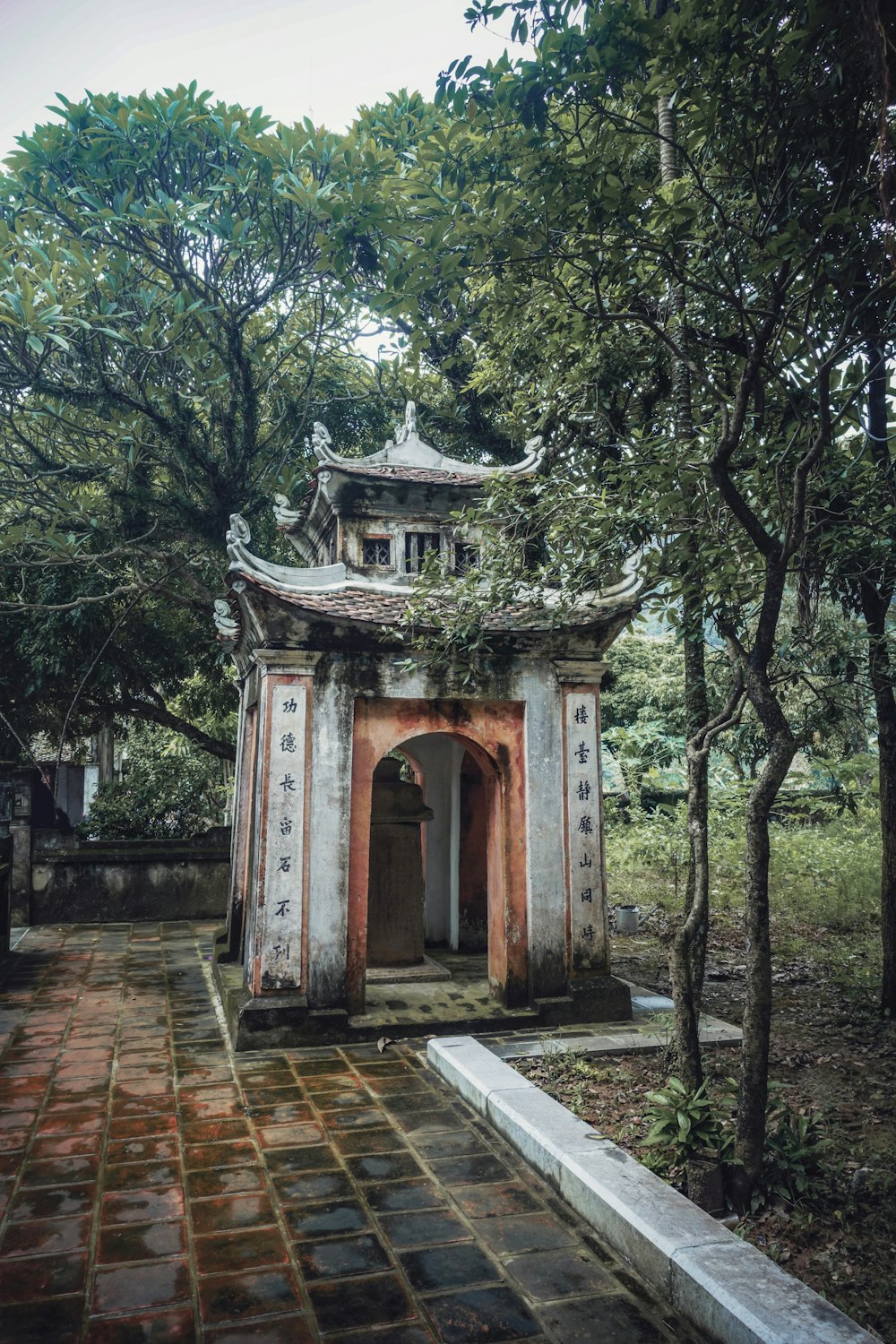 gray concrete temple surround with trees during daytime