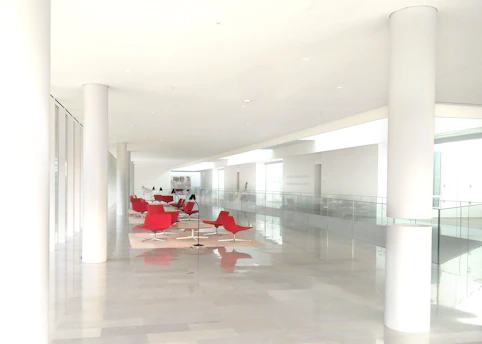 A serene, modern clinic hallway bathed in natural light, showcasing clean design and subtle branding of Precision Clinics.