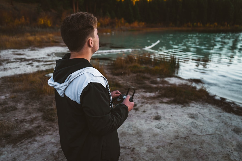 man holding drone controller