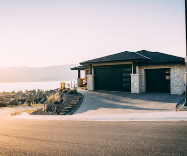 house 2 garage doors are both close during daytime