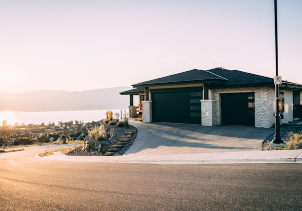 house 2 garage doors are both close during daytime