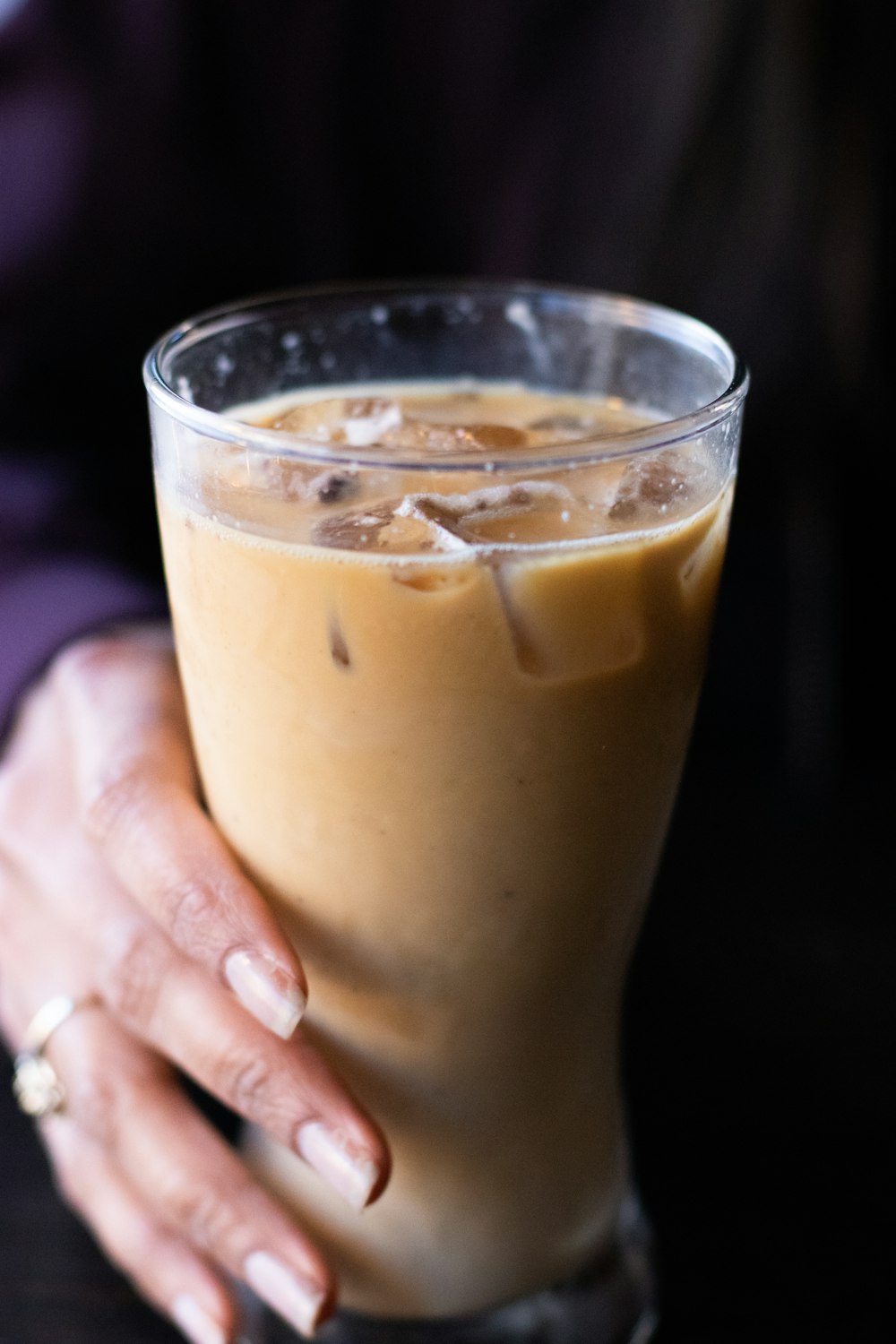 person holding clear drinking glass