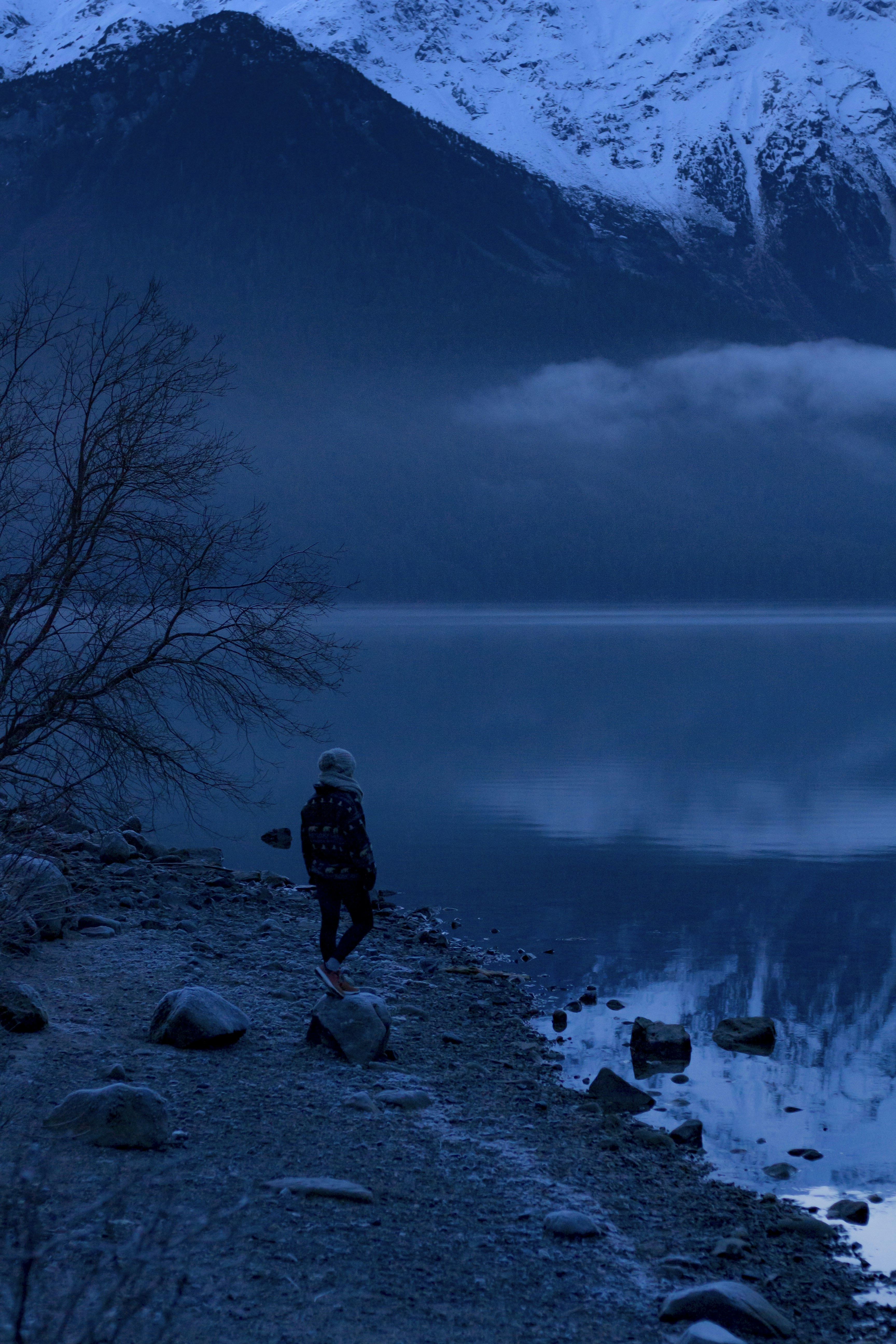 person standing nearby body of water