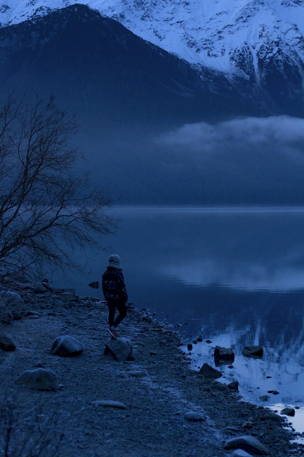 person standing nearby body of water