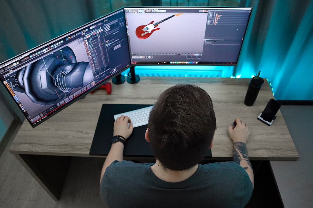man sitting and using computer,