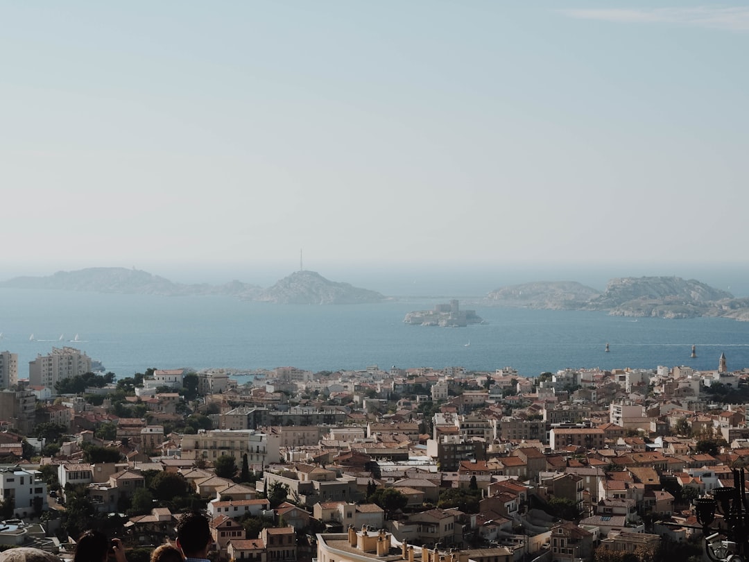 city buildings near body of water and islands